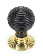 Load image into Gallery viewer, 91729 Ebony & Polished Brass Beehive Mortice/Rim Knob Set